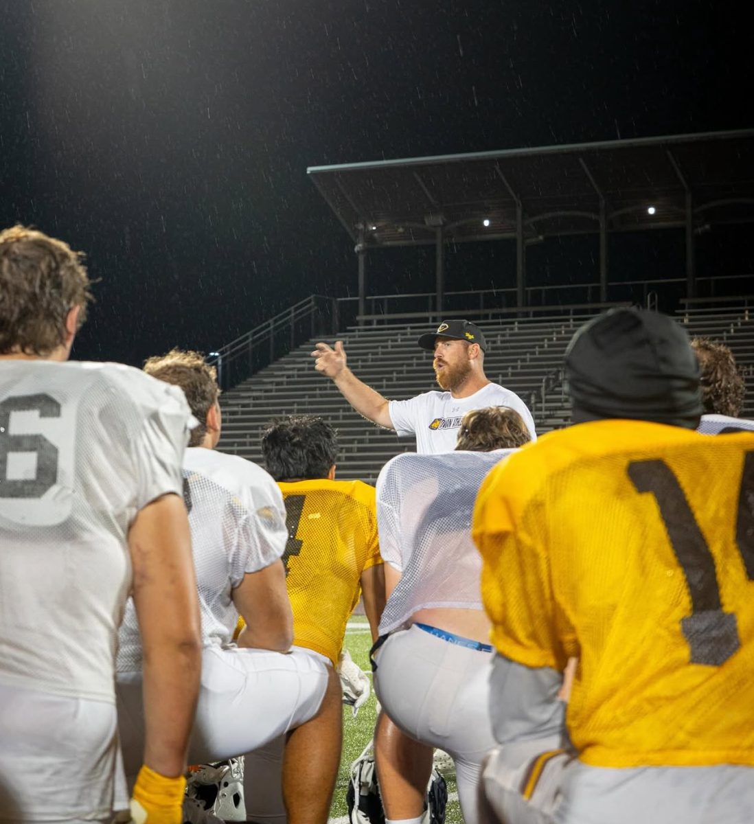Head coach Pat Ruley meets with his team during training camp. - Photo via @rowanfootball on Instagram