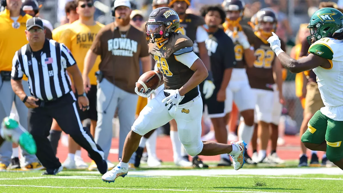 Running back Nunes Bukula IV runs the ball. Bukula IV scored a touchdown on the Profs opening drive against the Spartans. - Photo via Rowan Athletics