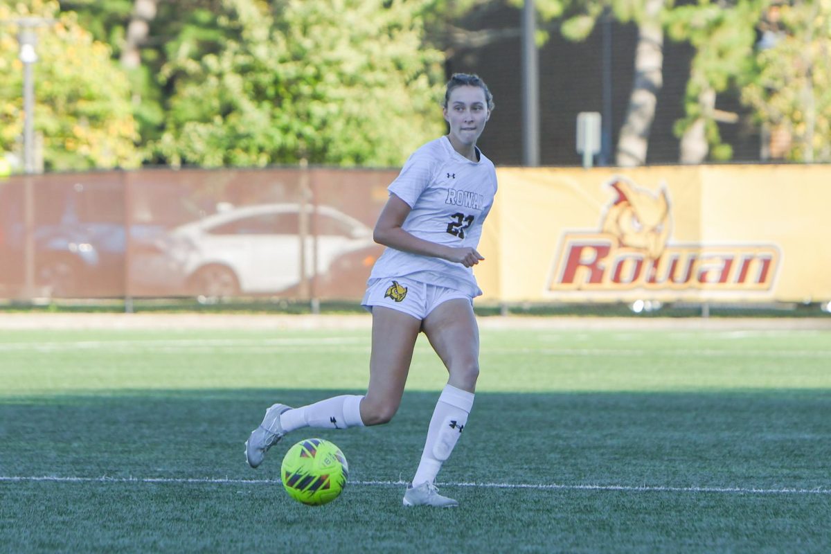 Cali Sloan dribbles the soccer ball. Sloan scored a goal on Saturday against William Paterson. (Contributor / Trevor Miceli)