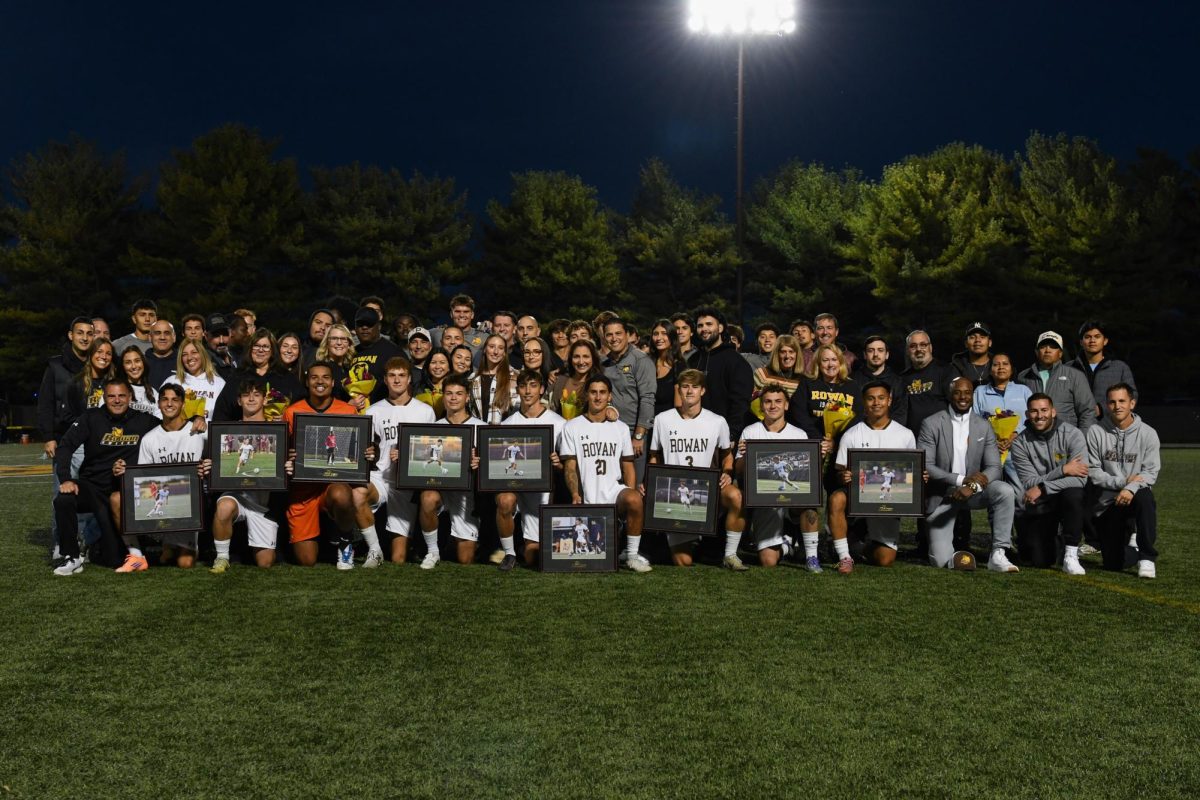 The seniors of the men's soccer team take a group picture with their families. The seniors were honored with a pregame ceremony prior to taking on Montclair State. Glassboro, N.J. Saturday, Oct. 18, 2025. (Sports Photographer / Trevor Miceli)