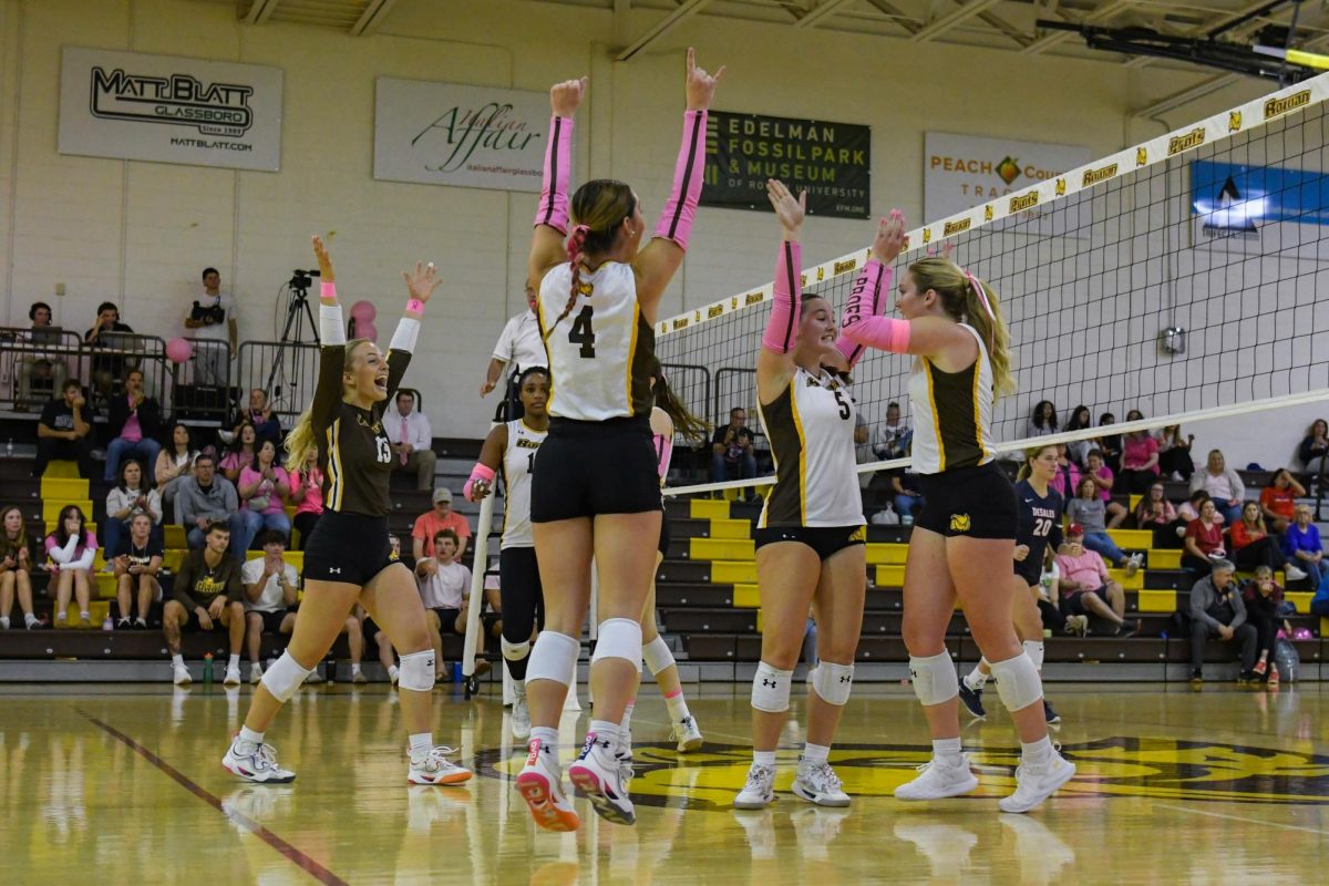 Rowan women's volleyball celebrates getting a point during a set. (Sports Photographer / Trevor Miceli)