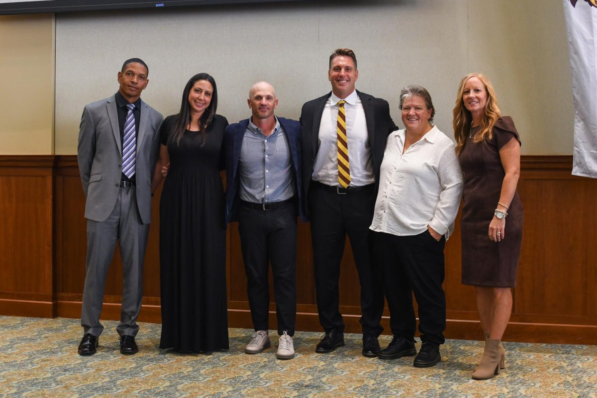 The Rowan University-Glassboro State College Hall of Fame class of 2025. From left to right, Clinton Tabb '03, Jamie Elias Laspata '02, Tony Racioppi '04, Abby Singley '05, John Yurkow '01, and Sandy Duda '96. Glassboro, N.J. Sunday, Oct. 19, 2025. (Sports Photographer / Trevor Miceli)