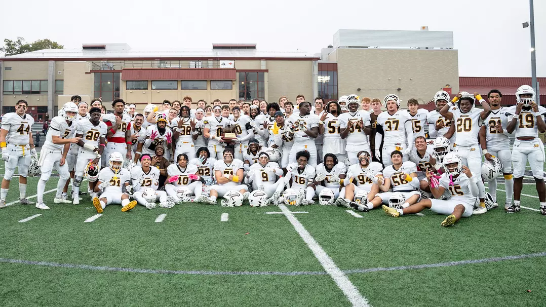 The football team poses with the Breakfast Bowl trophy. Montclair, N.J. Saturday, Oct. 11, 2025. (Contributor / Kevin Alexander)