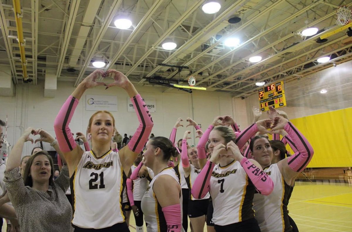 Rowan women's volleyball holds up heart hands to the camera for head coach Deana Jespersen to see. Glassboro, N.J. Tuesday, Oct. 28, 2025. (Sports Photographer / Melanie Barahona)