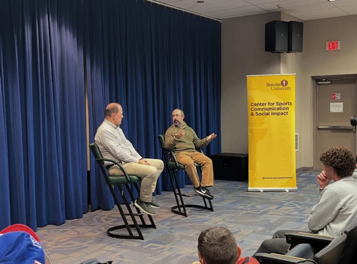 Dave Zangaro (right) speaks to the crowd of students inside King Auditorium. Glassboro, N.J. Monday, Oct. 13, 2025. (@rowansportscam on Instagram)