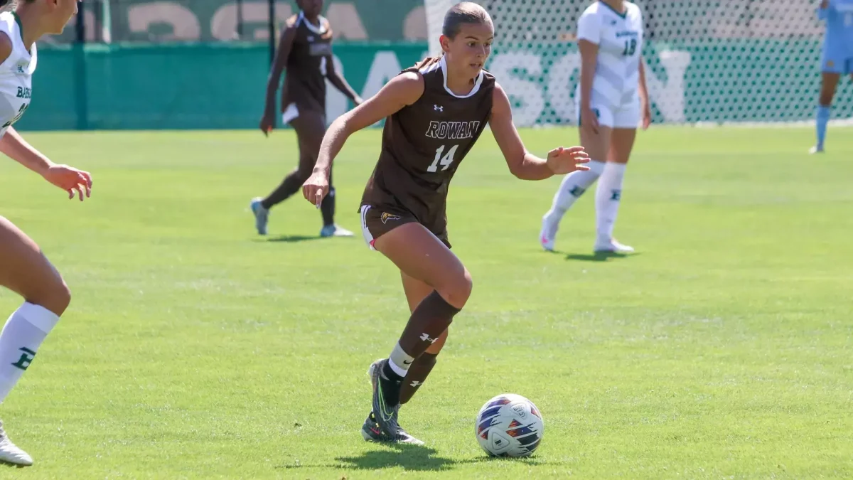 Bella Moore dribbles the ball. Rowan is Moore's third team in three years of collegiate women's soccer. (Rowan Athletics)