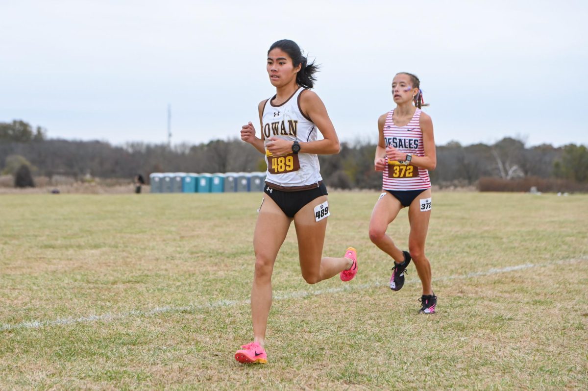 Gabriella Pagano runs in a race. Pagano placed 45th at the NCAA Division III Cross Country Championship. (Sports Photographer / Trevor Miceli)