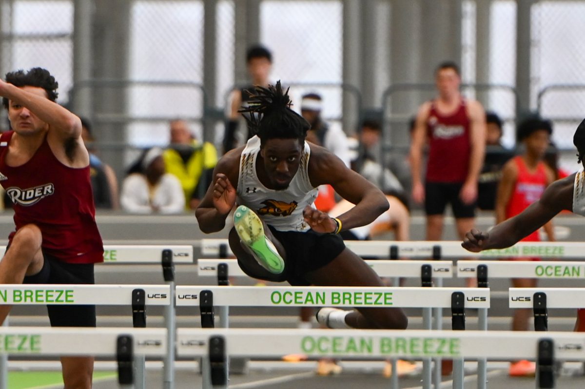 Jason Agyemang competes in the hurdles. Agyemang finished second in the 200 meter hurdles at the Fasttrack Season Opener. Staten Island, N.Y. Friday, Dec. 6, 2025. (Sports Photographer / Trevor Miceli)