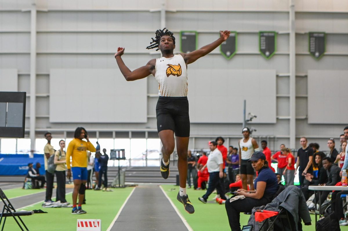 Anthony Parker during the long jump. Parker broke his own record in the long jump at the Fasttrack Invitational. (Sports Photographer / Trevor Miceli)