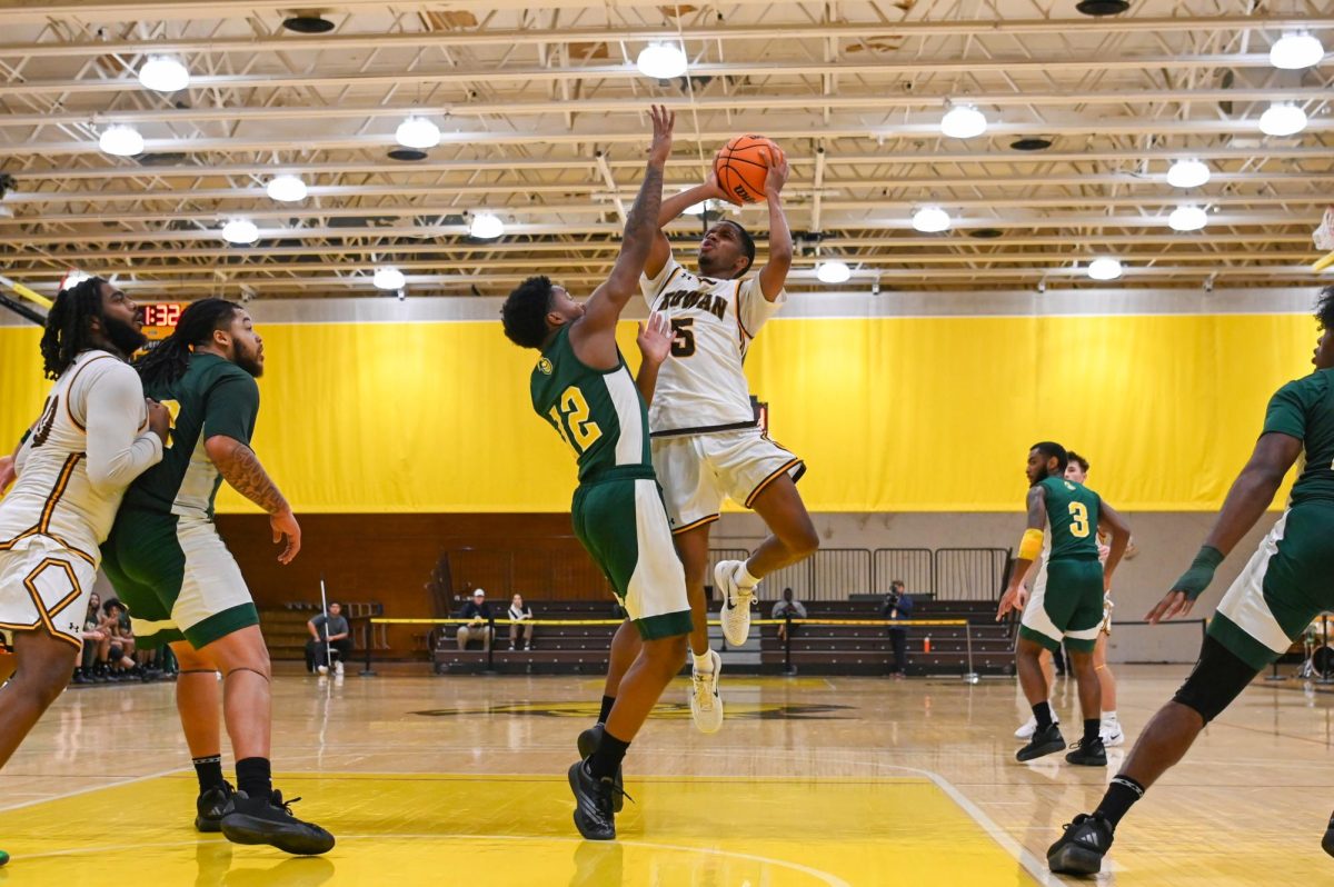 Brycen Williams shoots the basketball. Williams led his team with 27 points against NCJU in the NJAC Quarterfinal. (Sports Photographer / Trevor Miceli)