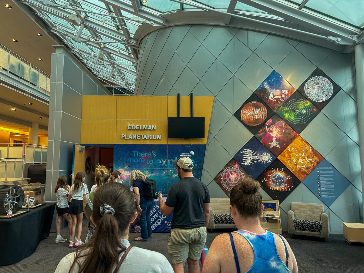 People line up at the Edelman Planetarium inside of Science Hall to see a laser show. Friday, June 21, 2024. Glassboro, N.J. (News & Photography Editor / Christopher Otto)