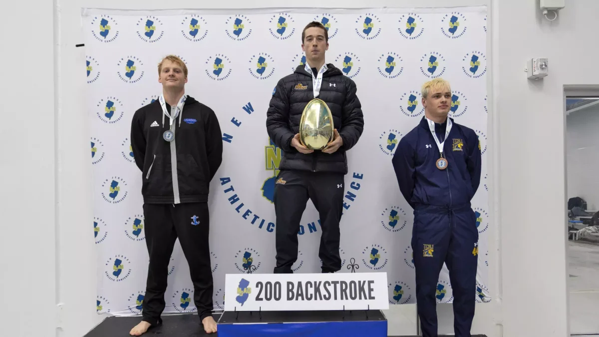 Braden Sheehan at the 200 break stroke award ceremony. Sheehan placed first in the 200 backstroke at the NJAC Championships. (Rowan Athletics)