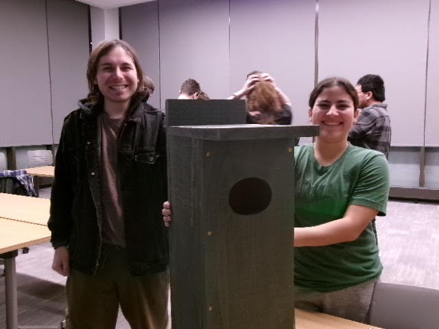 Zack Pascale stands next to Rachael Irizarry presenting their complete Wood Duck House. Discovery Hall, Room 201, Rowan University. Wednesday, February 11th, 2026. (Sara Goodstein / Contributor) 
