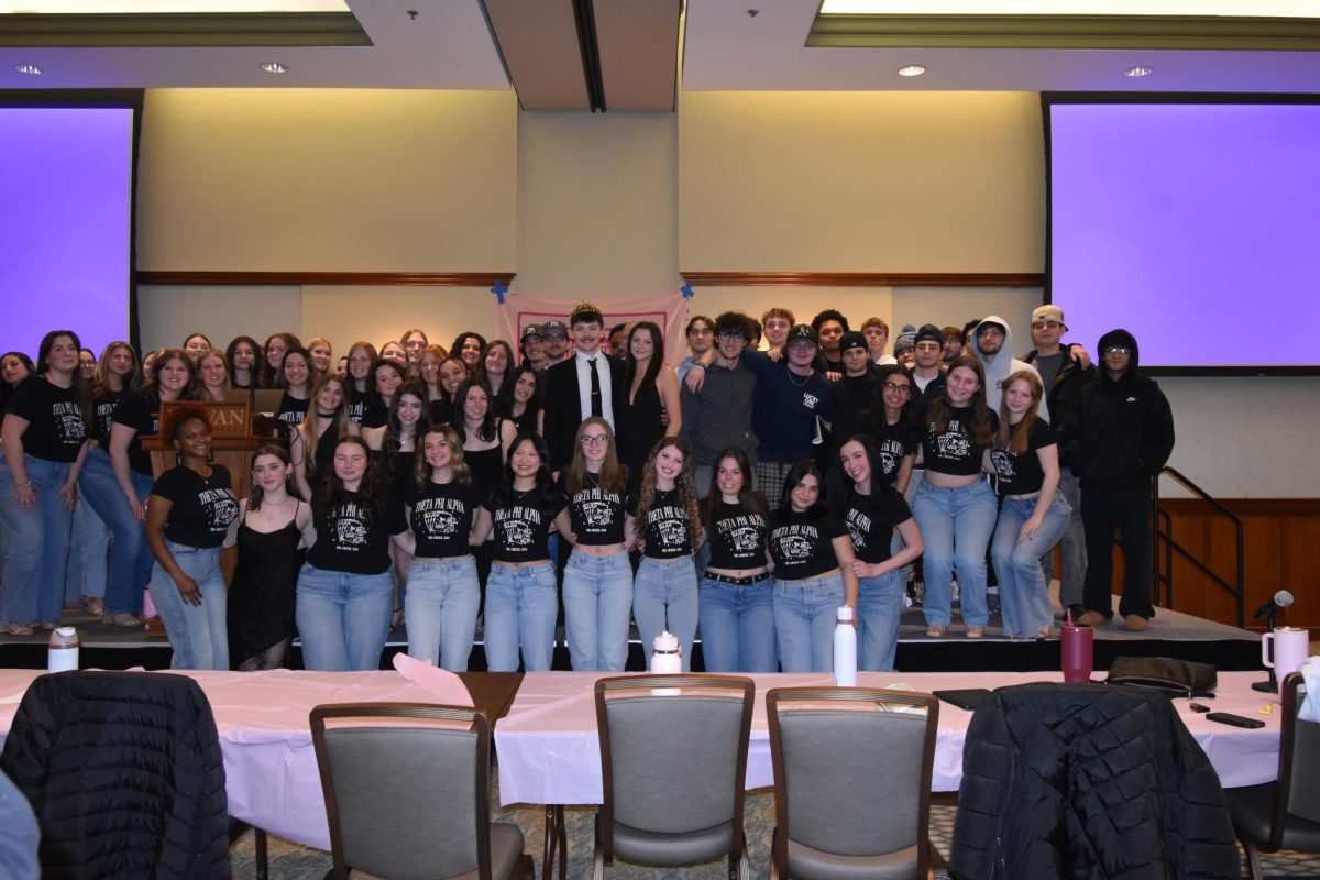 Theta Phi Alpha and Phi Kappa Psi Pose at Mr Greek. (Staff Photographer/Gia Chierici)