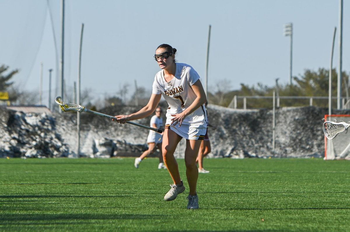 Trish Gillen cradles the ball. Gillen scored three goals against Ursinus. (Sports Photographer / Trevor Miceli)