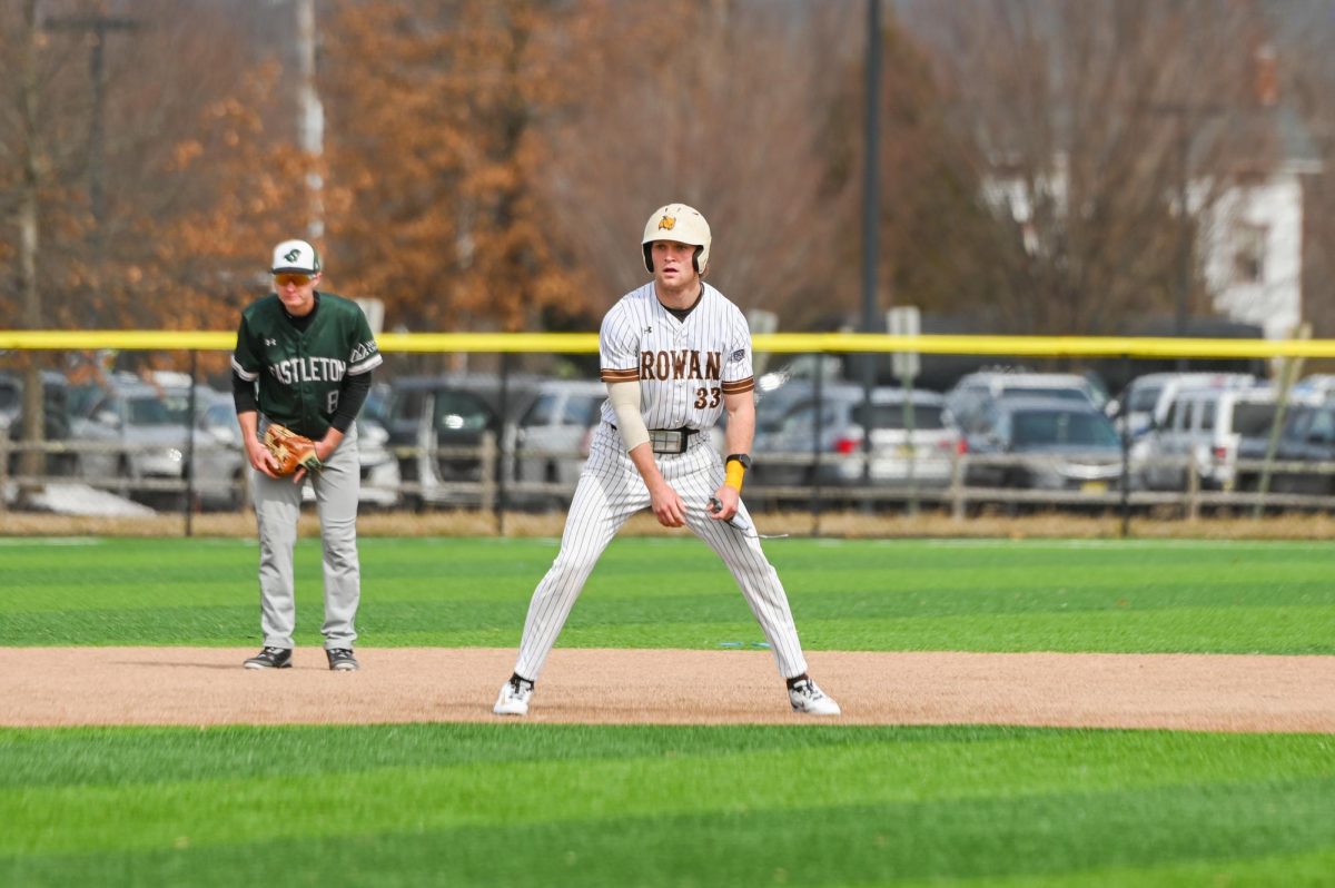 Brayden Davis takes a lead between second and third base. Davis hit his sixth home run of the season against Cairn. (Sports Photographer / Trevor Miceli)