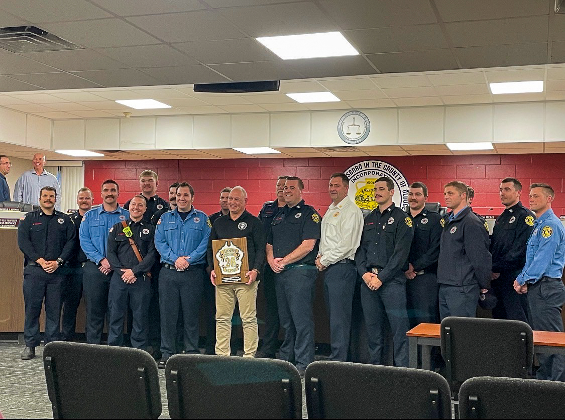 The Glassboro Council stand with retiring Borough Administrator Edward Malandro. Tuesday, March 24, 2026. Glassboro, N.J. (Staff Writer / Melanie Barahona)