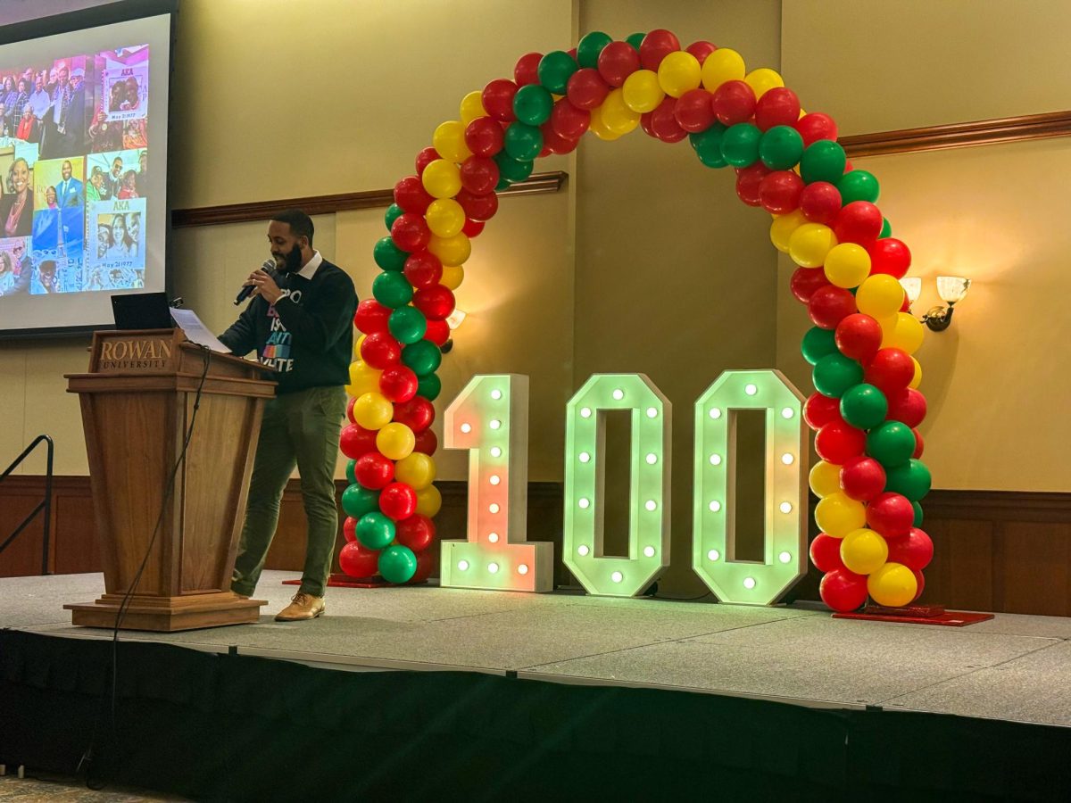One of the organizers of the event gives an introductory speech on stage. Thursday, March 5, 2026. Glassboro, N.J. (Contributor / Ezequiel Palacios)
