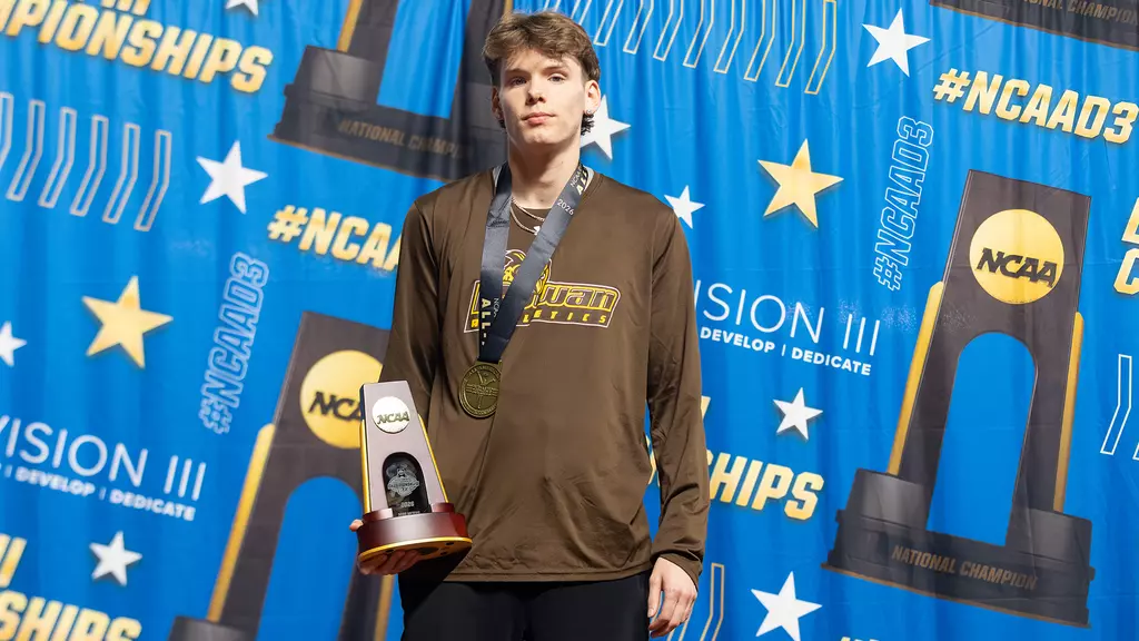 Seth Clevenger accepting one of his first place awards at the NCAA Indoor Track and Field Championships. Birmingham, Ala. (Rowan Athletics)