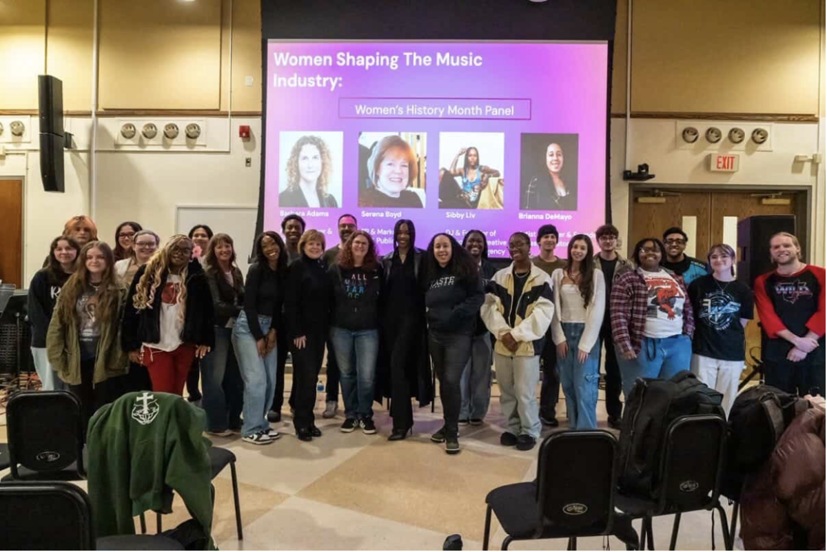 Attendees and panelists for “Women Shaping the Music Industry: Women’s History Month Panel” line up for a photo (Max Joy)