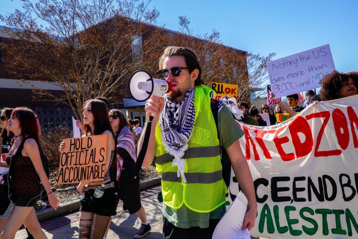 Rowan YDSA co-chair Jimmy Flocco leads the march outside Business Hall. Tuesday, March 10, 2026. Glassboro, N.J. (Staff Writer / Nick DiCicco)