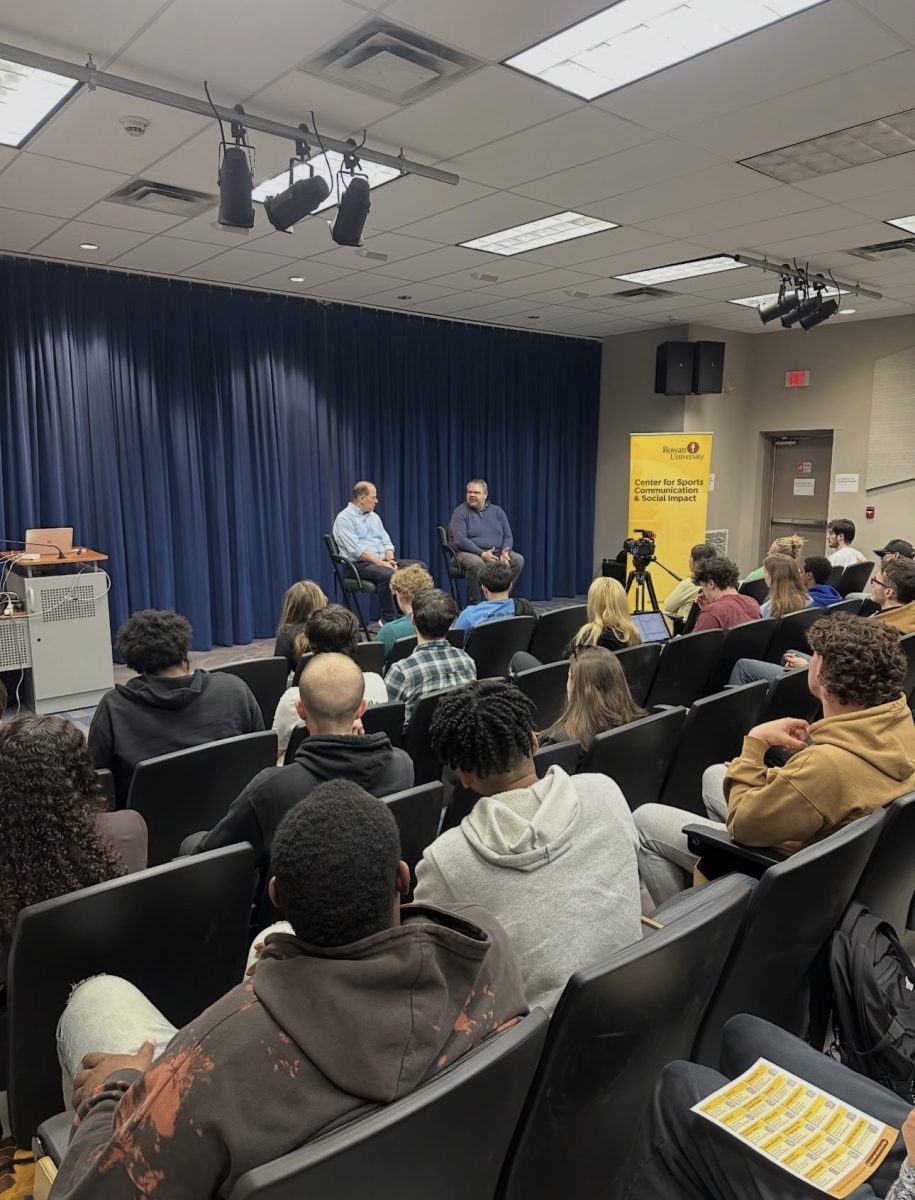 Bryan Sklover talks to the crowd of students inside King Auditorium. (@rowansportscam on Instagram)