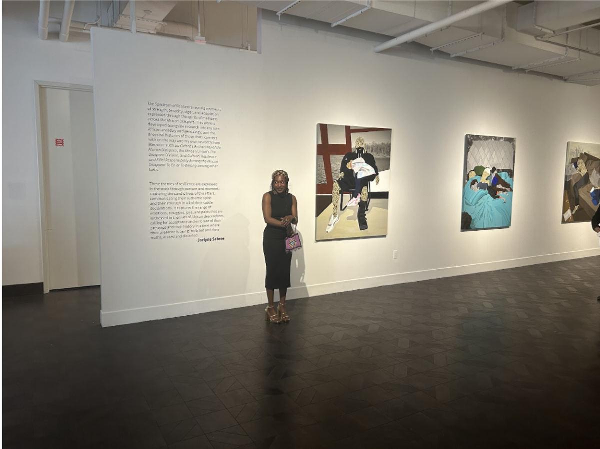 Jazlyne Sabree introduces herself for her speech in front of her works of art (Staff Writer / Christopher Burdash)
