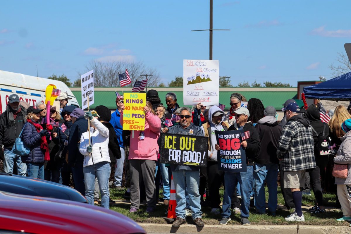 Protestors hold up their no kings signs. Saturday, March 28, 2026. Glassboro, N.J. (Staff Writer / Antonette Dietz)