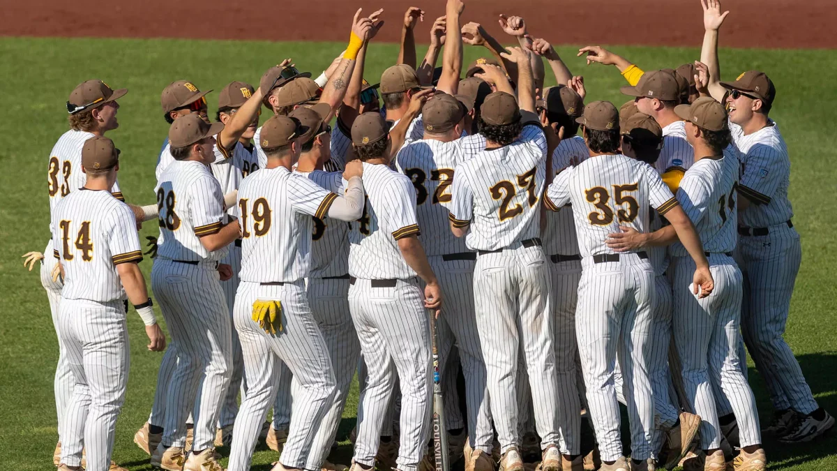 The Profs huddle up on the field. (Stockton Photo, Inc.)