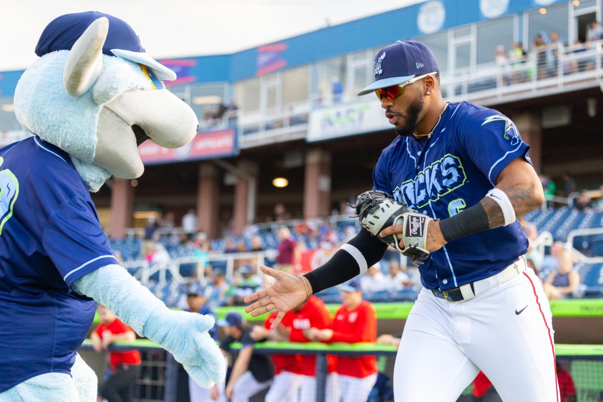Randal Diaz high fives Rocky Bluewinkle. (Lydia FitzGerald)